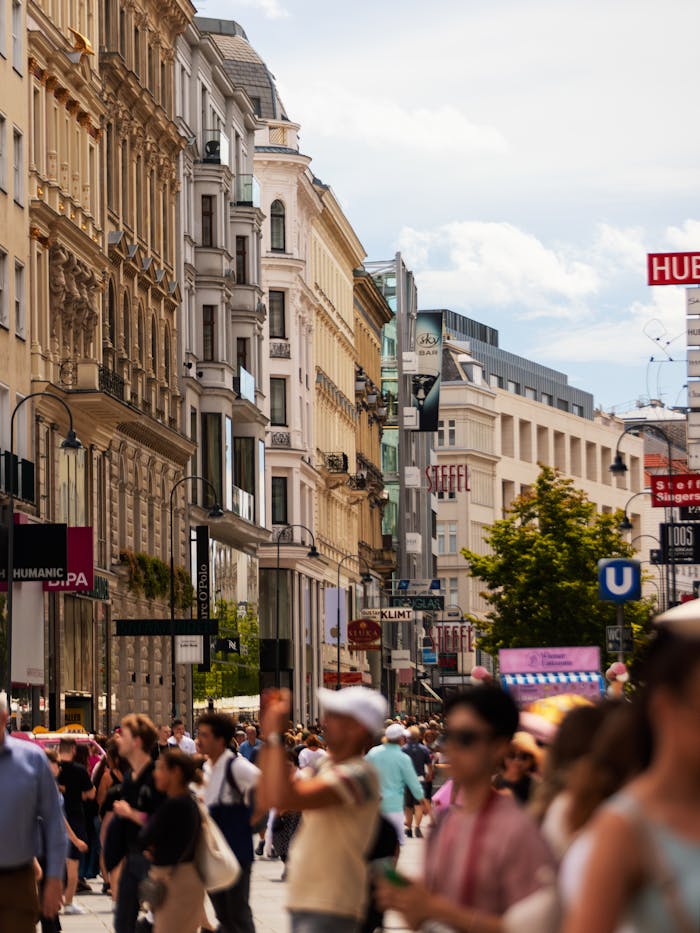 The Art of Drawing Readers In: Your attractive post title goes here Busy shopping street in Vienna, Austria, bustling with people and classic architecture.